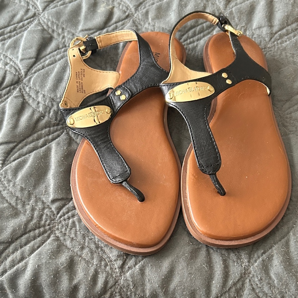 Michael Kors Black Leather T-Strap Sandals with Gold Hardware